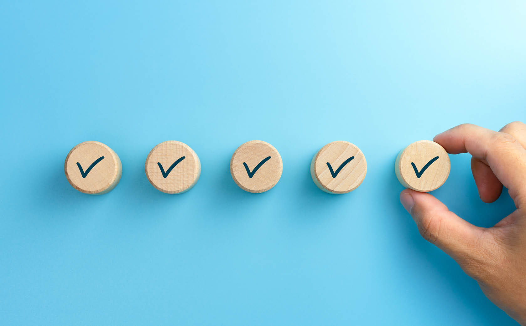 ticked wooden buttons on blue background